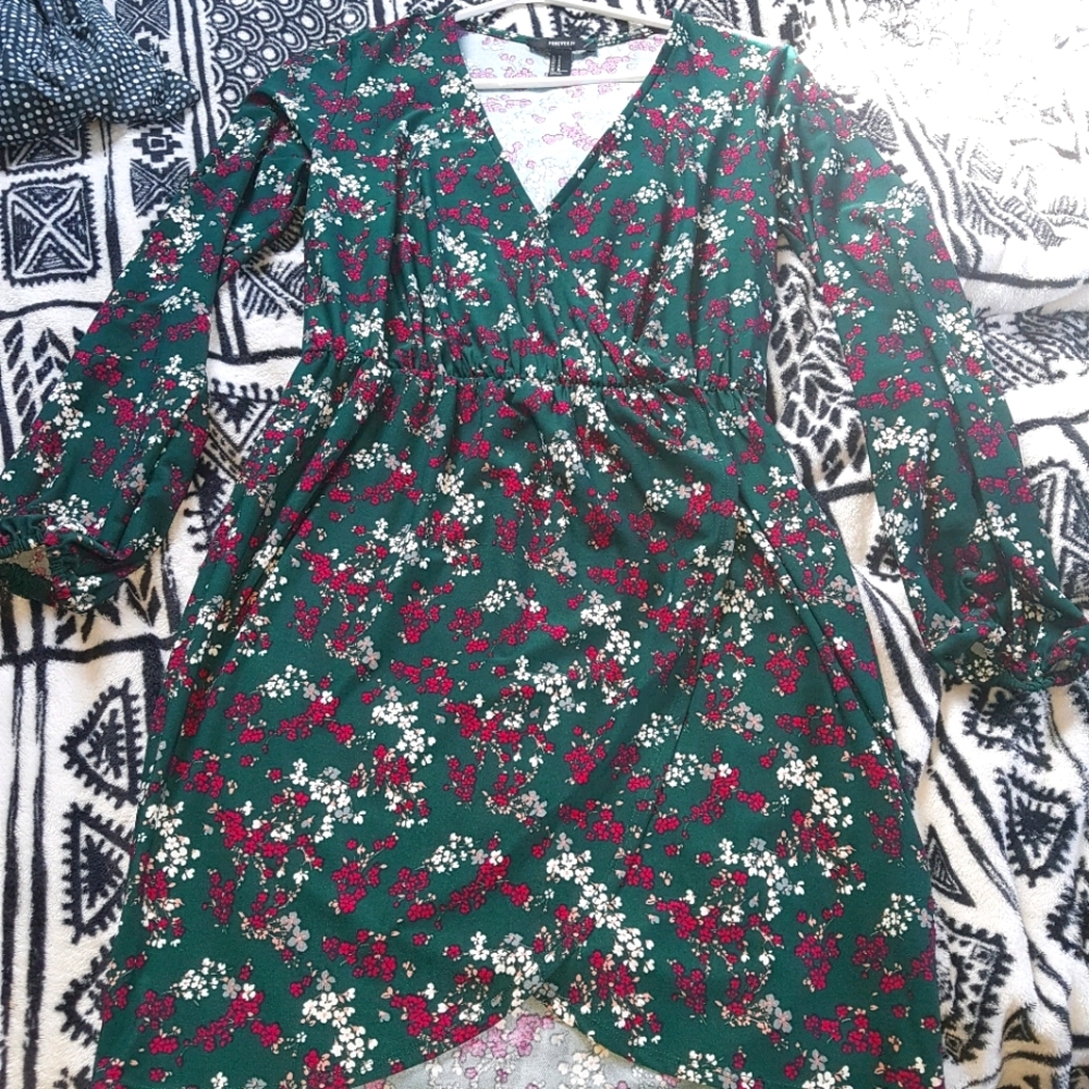 Long sleeve knee length dress.